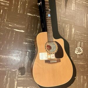 Acoustic guitar with hard case